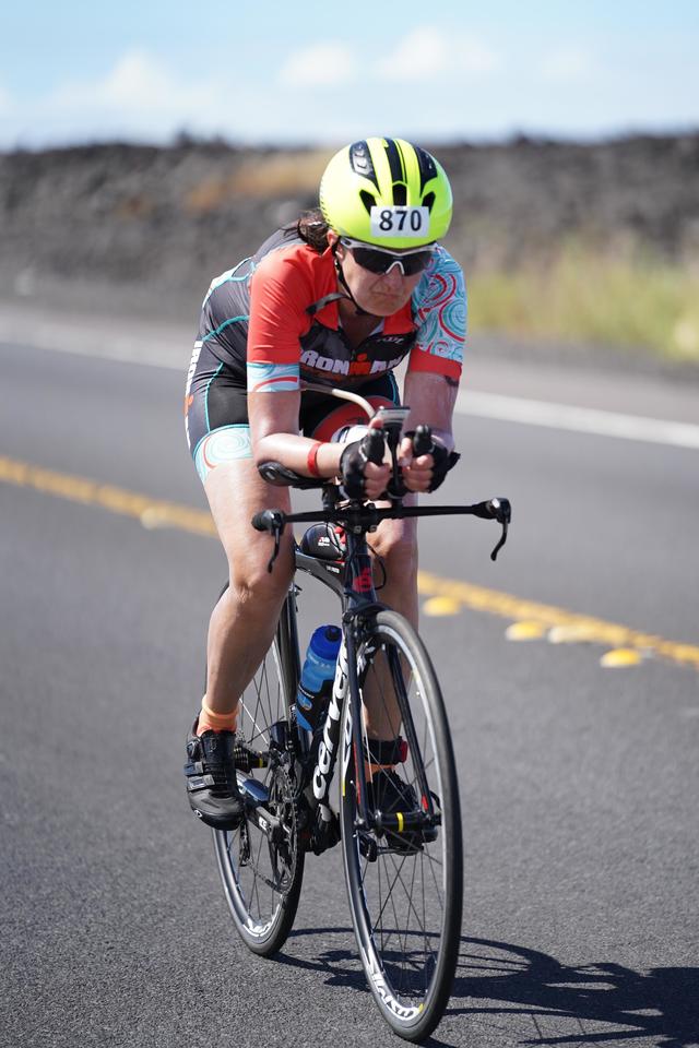 Weiskopf-Larson biking in the second portion of the Ironwoman.