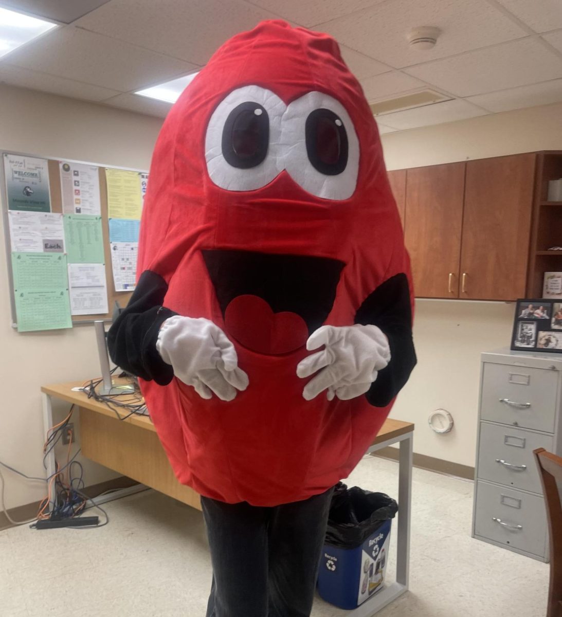 Effervescent NHS President, senior Jonin Morgan, serves in blood drop costume. Show up to Friday's blood drive to find out who was inside the costume visiting classrooms last week...