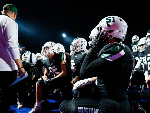 Mounds View Football team listens to Varsity Coach Aaron Moberg give a speech.