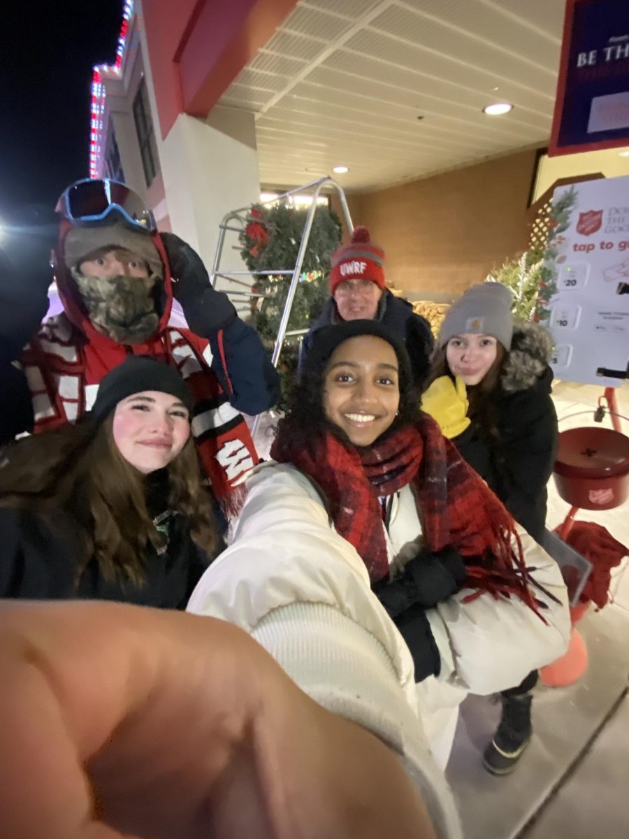 Volunteer Outreach Club members ringing bells for Salvation Army